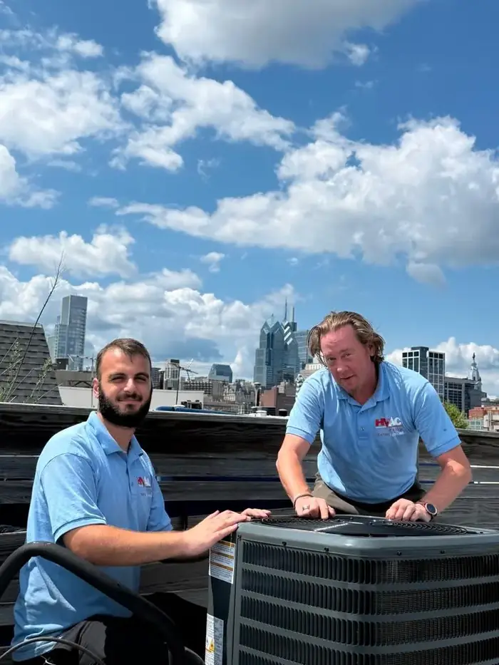Licensed HVAC Philly technician servicing a residential AC condenser